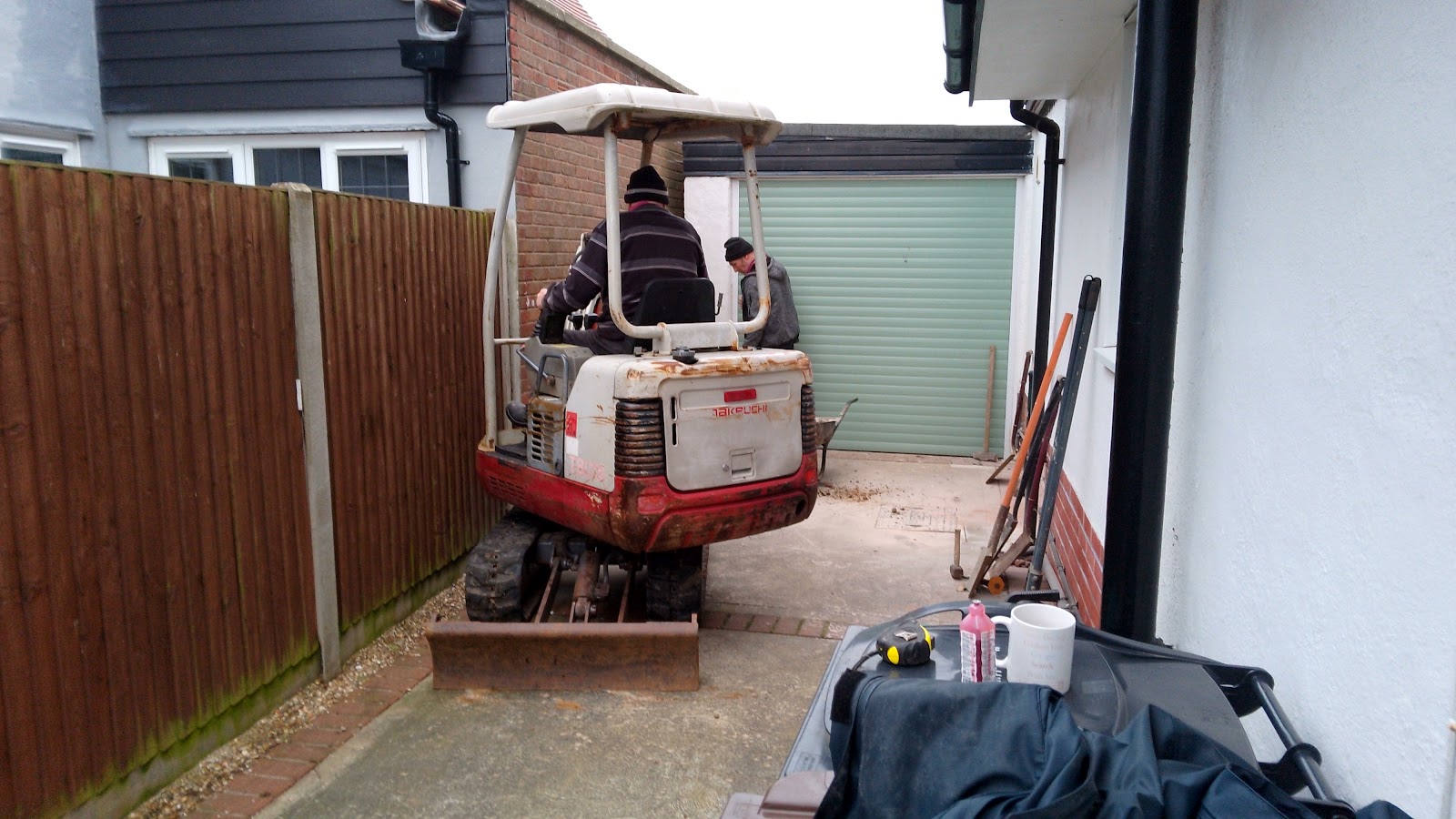 Mini digger working in a tight side passage