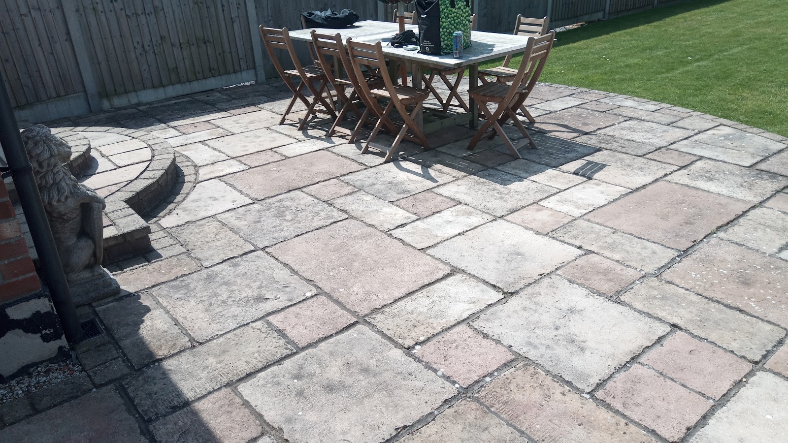 Block-paved patio with garden dining table and chairs