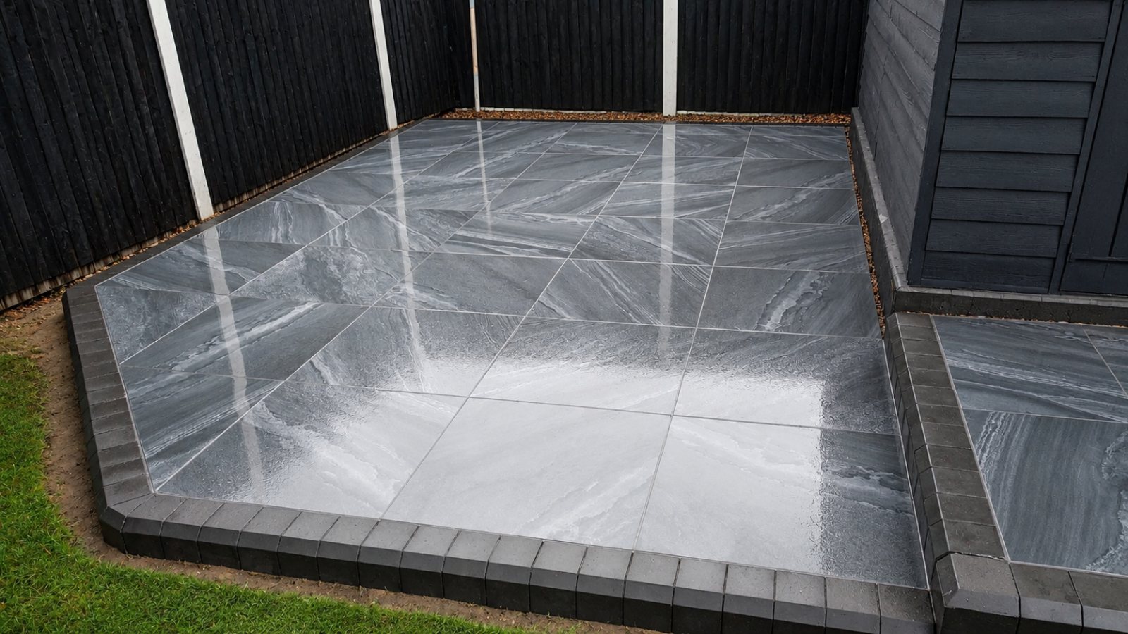 Curved brick steps and circular paving outside french doors