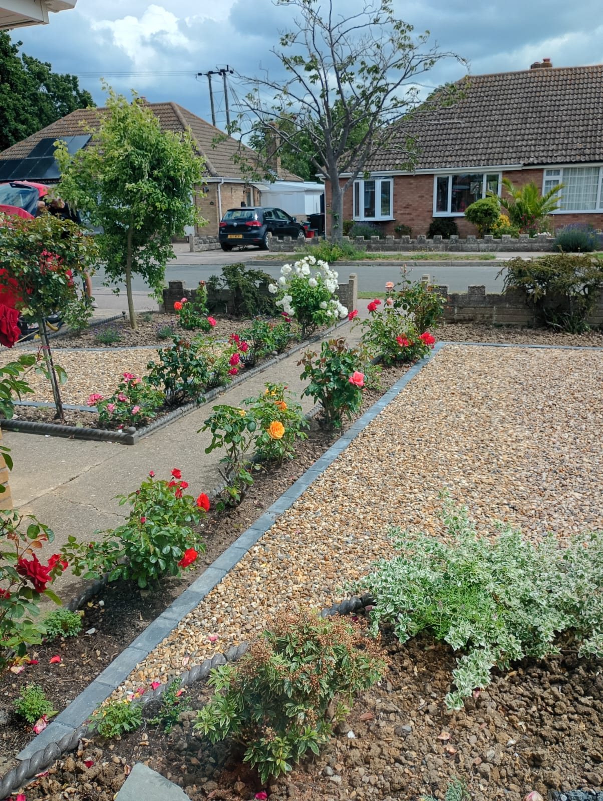 Circular garden feature under construction with stepping stones