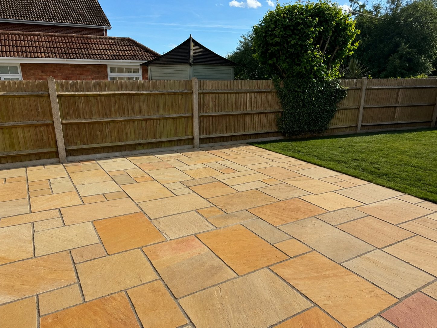 Front garden with new curved lawn and block-paved driveway